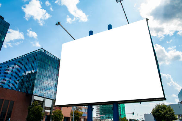 istock Advertising billboard mockup in front of modern office buildings 1224639336