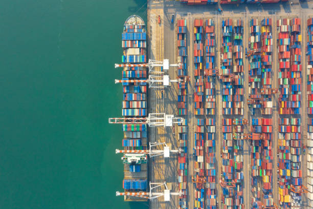 istock Container , container ship in export and import business and logistics. Shipping cargo to harbor by crane. Water transport International. Aerial view and top view. 1224640062