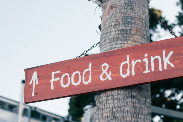 istock Food and drink sign on a tree pointing straight ahead 1224640636