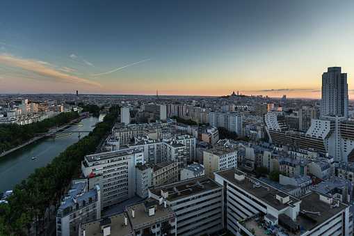 The city of Paris, as seen from a high window in La Villette looking down on the city between the Canal de l'Ourcq and Sacré Cœur. Part of a day to night series.