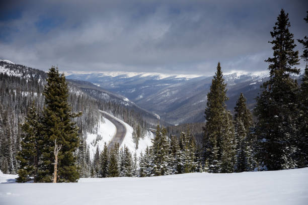 istock Snow and Fog Over Switchbacking Highway in the Rocky Mountains 1224640769