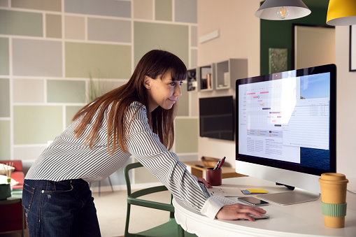 Adult woman planning the weekly business schedule during corona virus outbreak