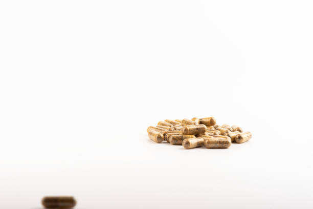 istock Capsules with medicine or vitamins on a white background. Selective focus. 1224641686