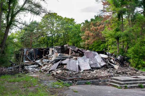 Photo of Charred and blackened remains of building destroyed by a fire