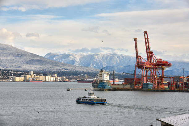 Vancouver, British Columbia, Canada – January 1, 2017. Commuters travel across Burrard Inlet to downtown North Vancouver in the morning.