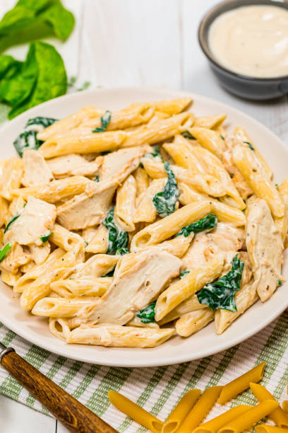 istock Chicken Alfredo with Spinach Penne Pasta 1224644599