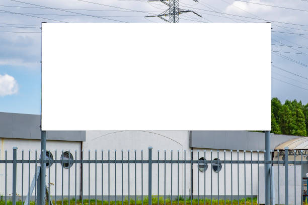 istock Blank white billboard for advertisement in the front of industrial building 1224645819