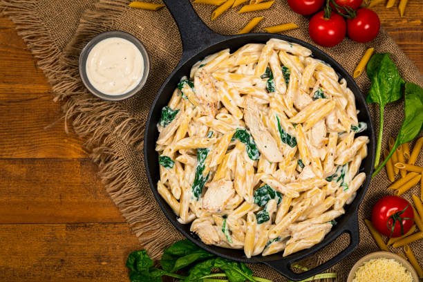 istock Chicken Alfredo Parmesan Penne Pasta with Spinach 1224646193