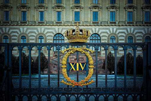 Stockholm, Sweden - November 27, 2018. The Royal Palace of Stockholm. The sign of King Carl XIV Gustaf.