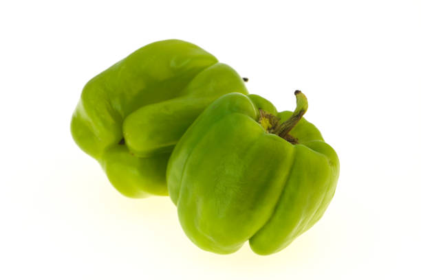 Two Green bell pepper isolated on white background