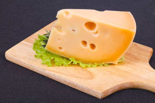 istock Maasdam cheese  in the board served salad leaves 1224646945