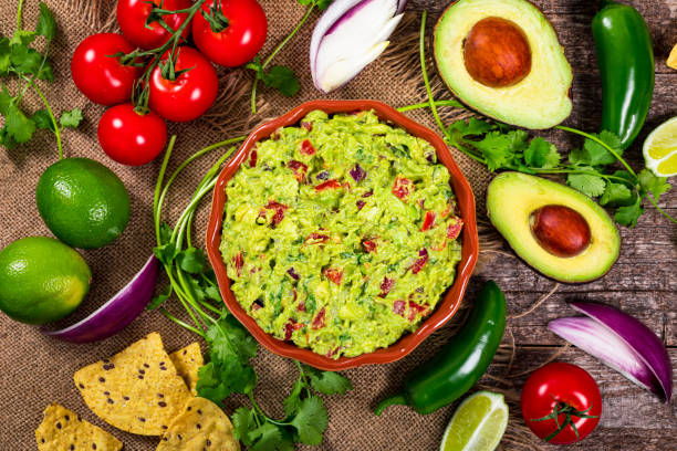 istock Avocado Guacamole Mexican Dip with Avocado, Lime, Tomato and Cilantro 1224650366