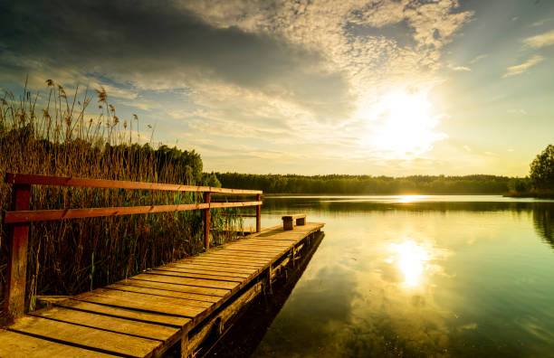 istock Old wooden footbridge on the lake 1224655287