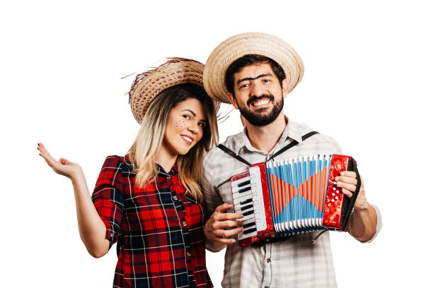 brazilian couple wearing traditional clothes for festa junina - june festival - santa hat fotos - fotografias e filmes do acervo