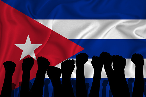 Silhouette of raised arms and clenched fists on the background of the flag of cuba. The concept of power,  conflict. With place for your text. 3D rendering