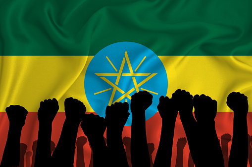 Silhouette of raised arms and clenched fists on the background of the flag of ethiopia. The concept of power,  conflict. With place for your text. 3D rendering