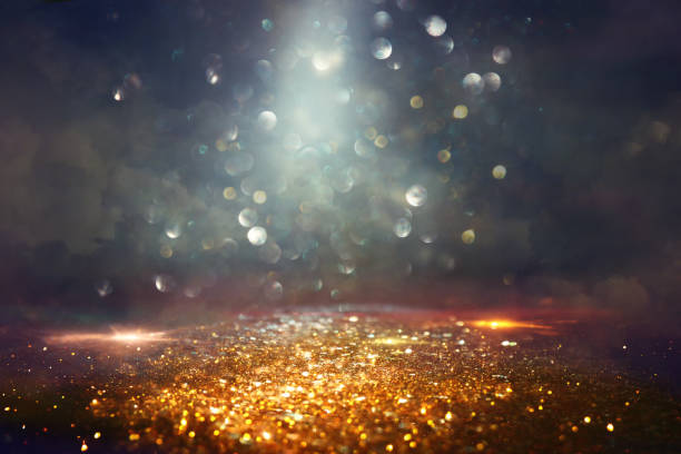 istock background of abstract glitter lights. gold and black. de focused 1224657763