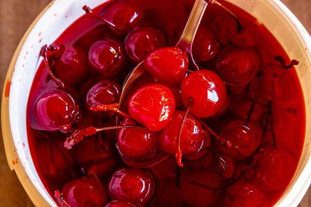 istock Delicious cherries in bowl on wooden background. 1224658433