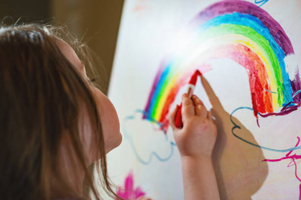 istock Girl Drawing on White Board Easel 1224659258