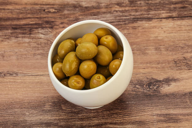 istock Green pickled olives in the bowl 1224659428