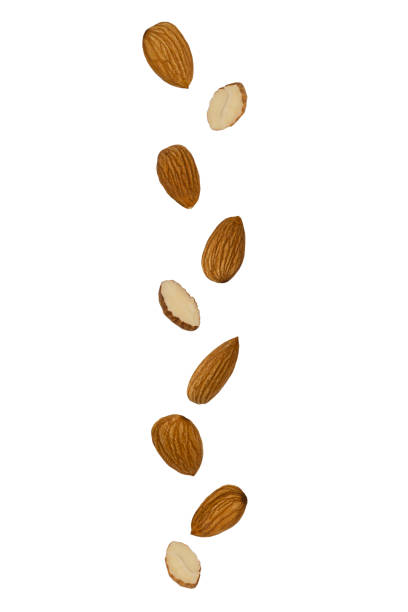 istock Flying food. Falling almonds isolated on a white background with clipping path as package design element and advertising 1224659715
