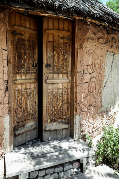 istock aged door in a clay house 1224660276