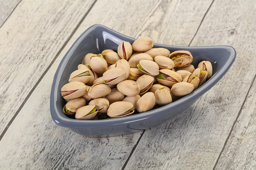 Pistachio nuts heap in the bowl