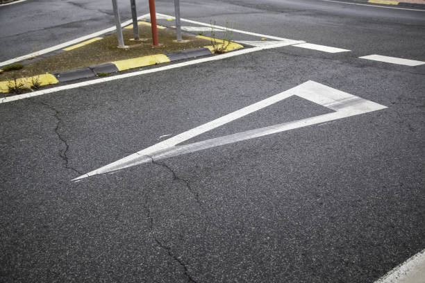 Yield sign on the asphalt, detail of information for traffic