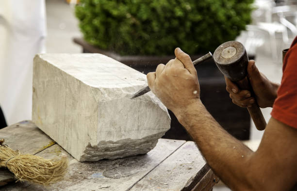 Man carving stone Man carving stone, detail of crafts and art chisel photos stock pictures, royalty-free photos & images