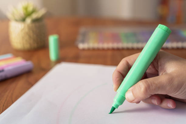 istock woman drawing with colored markers 1224663801