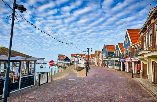 Volendam,the Netherlands Volendam is in North Holland, near Amsterdam. The famous tourist street in Volendam with souvenir shops, cafes and fish restaurants. Volendam is a historic fishing village on the IJsselmeer in North Holland. These photos of the empty streets and the port were taken during the pandemic in the spring of 2020.
