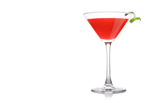istock Cosmopolitan cocktail in classic crystal glass with lime peel on white. 1224665111