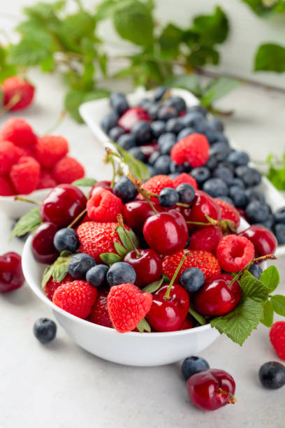 istock Various juicy berries with leaves. 1224667193