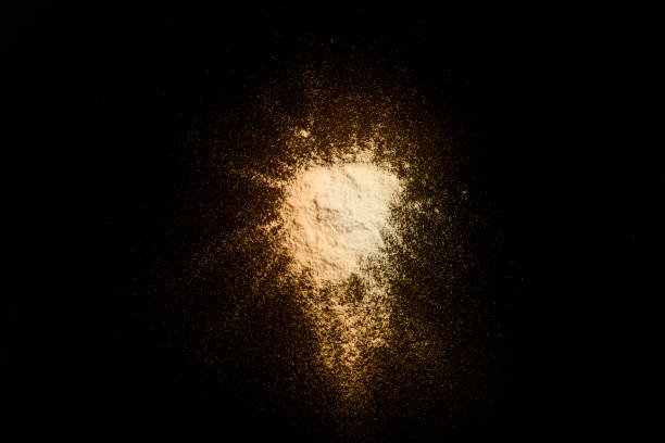 istock Colorful yellow splash on a black background 1224667652