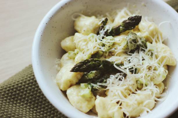 istock Gnocchi with asparagus, butter sauce and  grated cheese. 1224668548