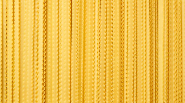 yellow dry mafaldine pasta background