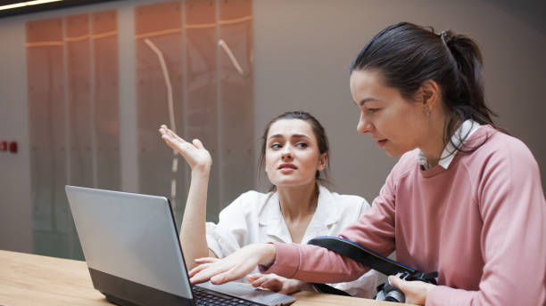 istock Coaching and mentoring, a professional helps a Junior colleague. The internship concept. 1224670040