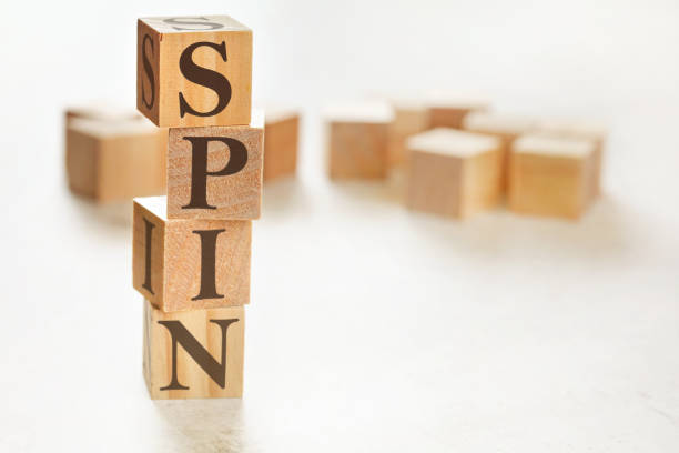 istock Four wooden cubes arranged in stack with word SPIN (meaning Solution Problem Implication Need) on them, space for text / image at down right corner 1224671129