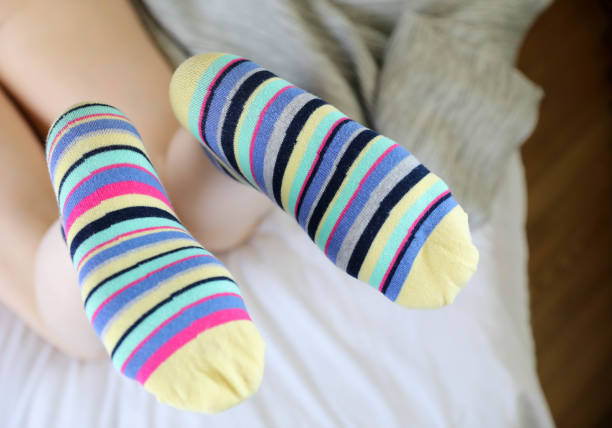 istock Women's beautiful socks on bed 1224671288