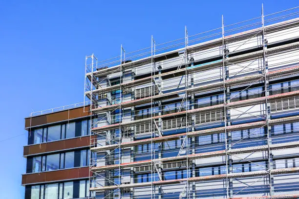 renovation of the facade of a multi storey house and thermal insulation using scaffolding