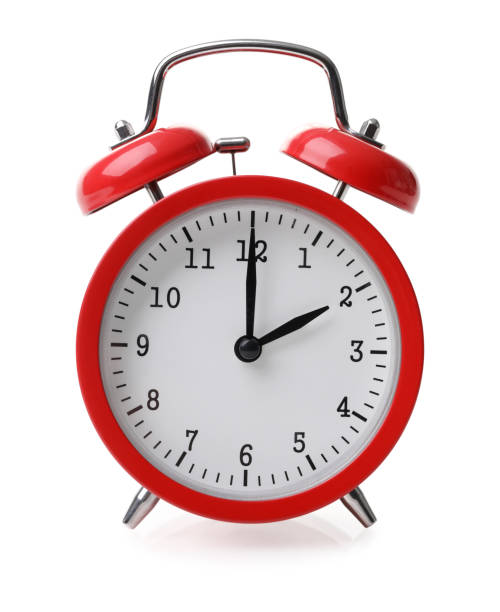 istock Red alarm clock set at two isolated over white background 1224672629