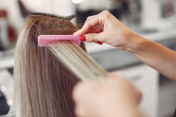 istock Hairdresser does hairstyle for her client 1224673848