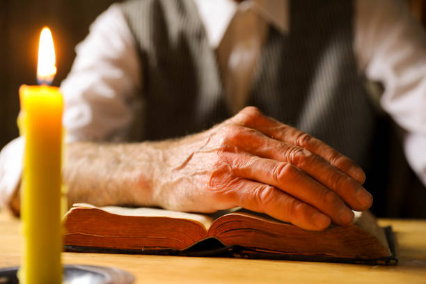 istock Praying Hands With Bible stock photo 1224675670
