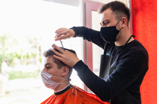 istock young man getting haircut at the barbershop 1224676193