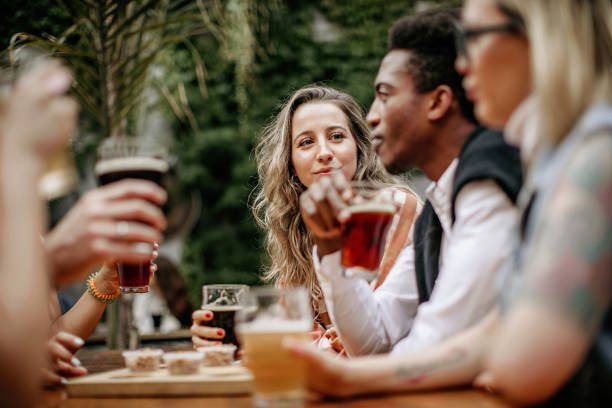 istock Friends drinking beer at outdoor restaurant 1224676379