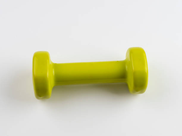 istock A small green dumbbell on white background 1224676622