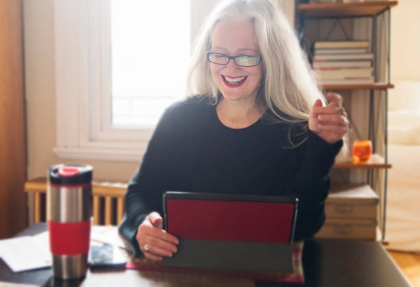 istock Stylish 50+ woman working from home. 1224678438