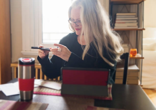 istock Stylish 50+ woman working from home. 1224679025