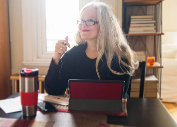 istock Stylish 50+ woman working from home. 1224679127