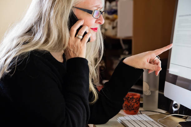 istock Stylish 50+ woman working from home. 1224679151